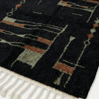 Fringe and edge detail of the Aghbal hand-knotted rug.