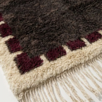 Brown and burgundy Beni Ourain rug detail