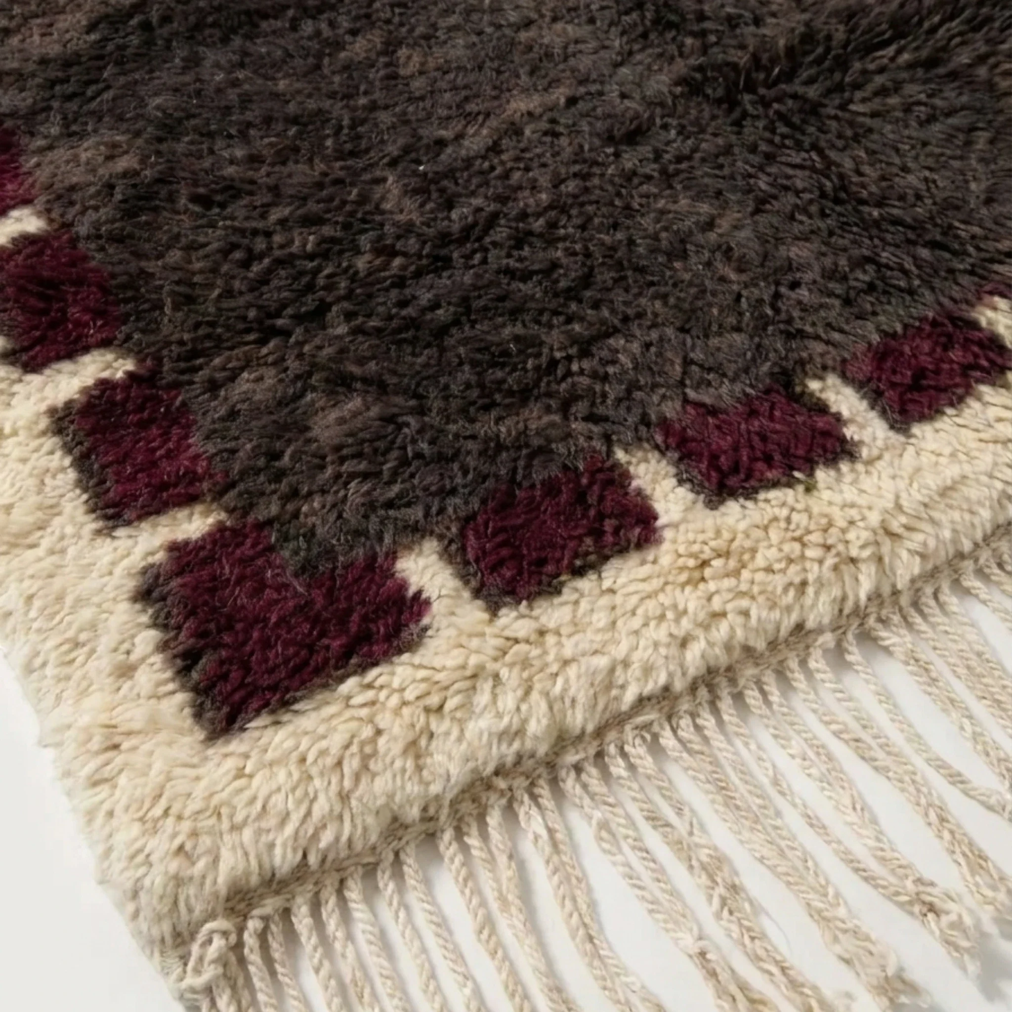 Brown and burgundy Beni Ourain rug detail