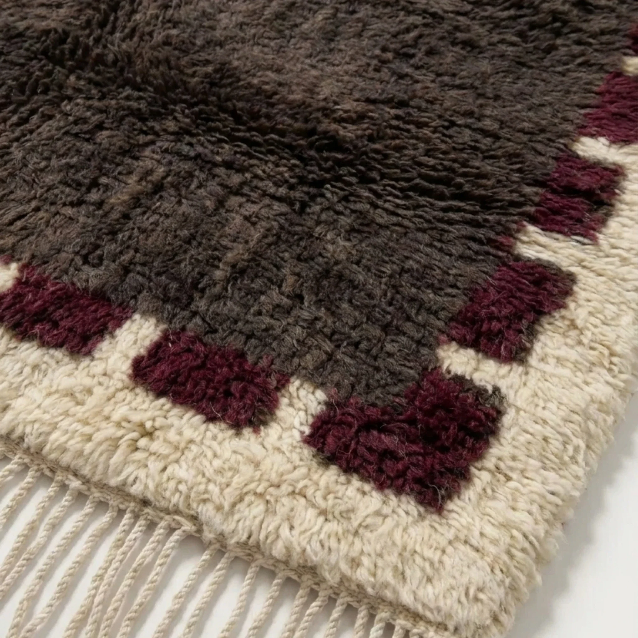 Brown and burgundy Beni Ourain rug detail
