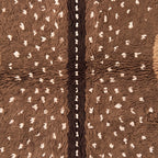 Central dark line dividing speckled stripes with cream fringe at base of Fawn rug