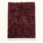 Burgundy Beni Ourain rug Tafat with thick textured pile and ivory fringe, flat lay