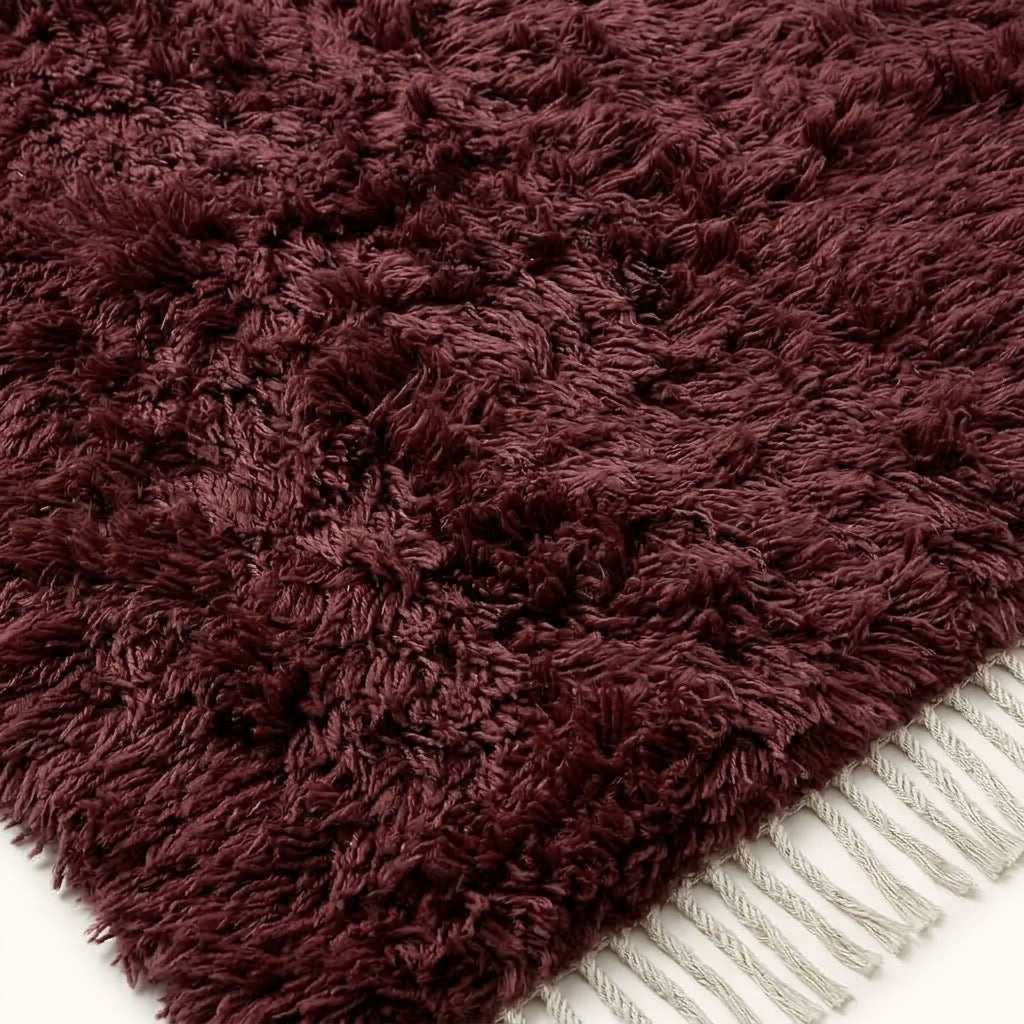 Ivory fringe and burgundy pile corner detail of Beni Ourain rug Tafat
