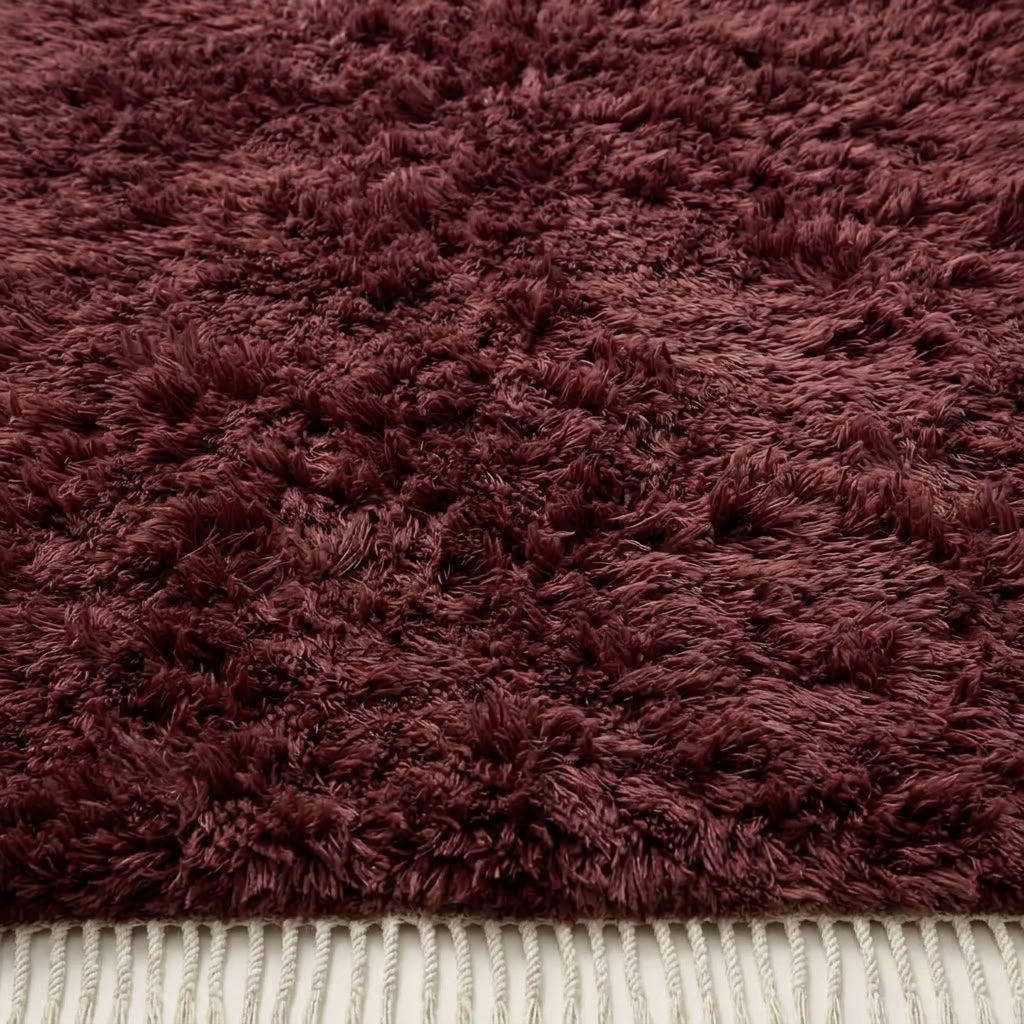 Burgundy textured pile detail showing depth and hand-knotted wool construction