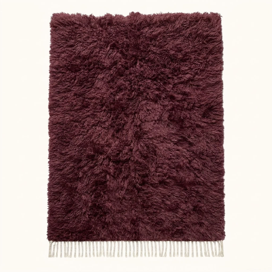 Full view of burgundy Beni Ourain rug with thick textured pile and undyed ivory fringe