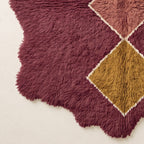 Corner edge detail showing wavy irregular border and cream fringe