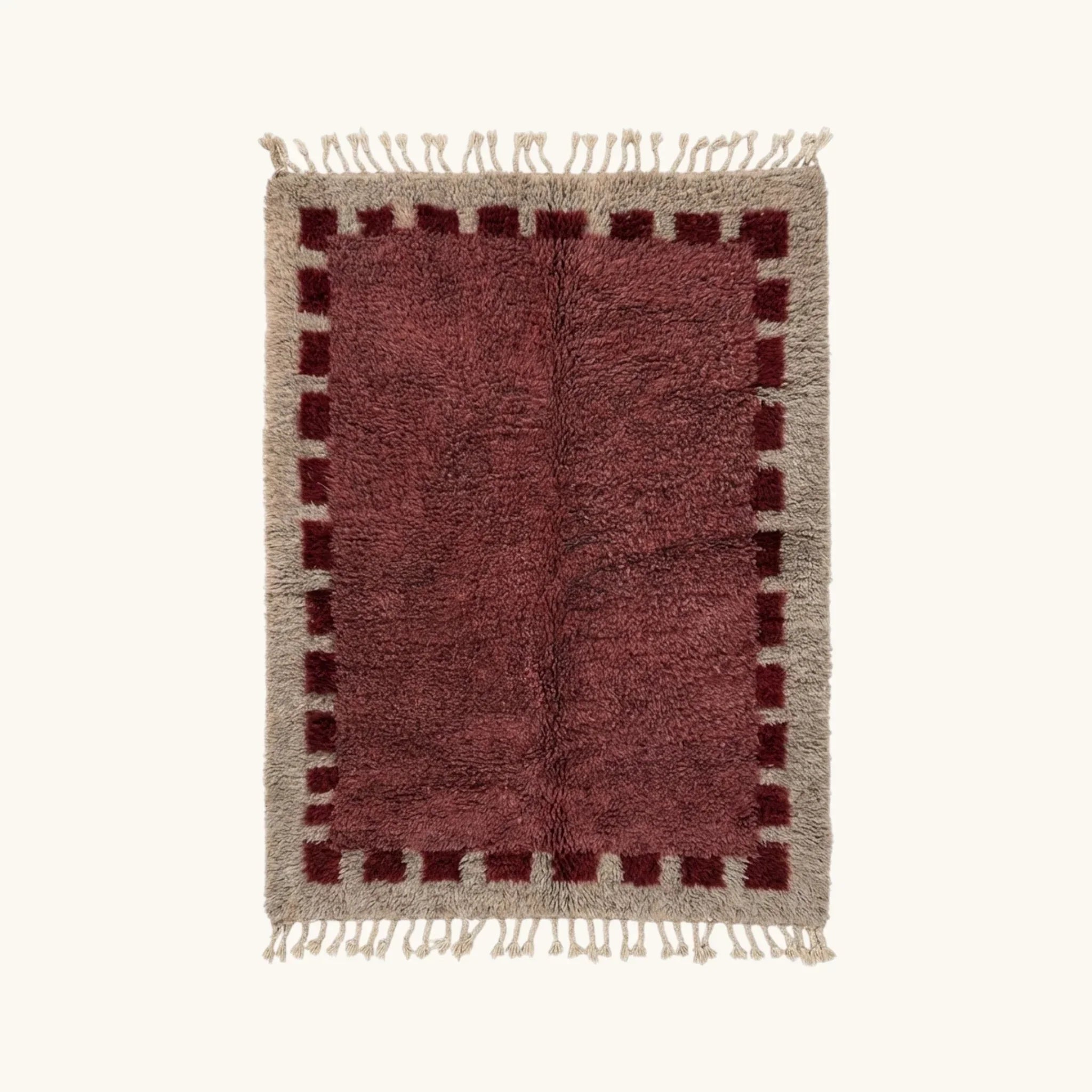 Full view of the Ziri burgundy and ivory Beni Ourain rug with a block border design.
