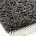 Angled close-up of charcoal Beni Ourain pile showing texture and depth of wool