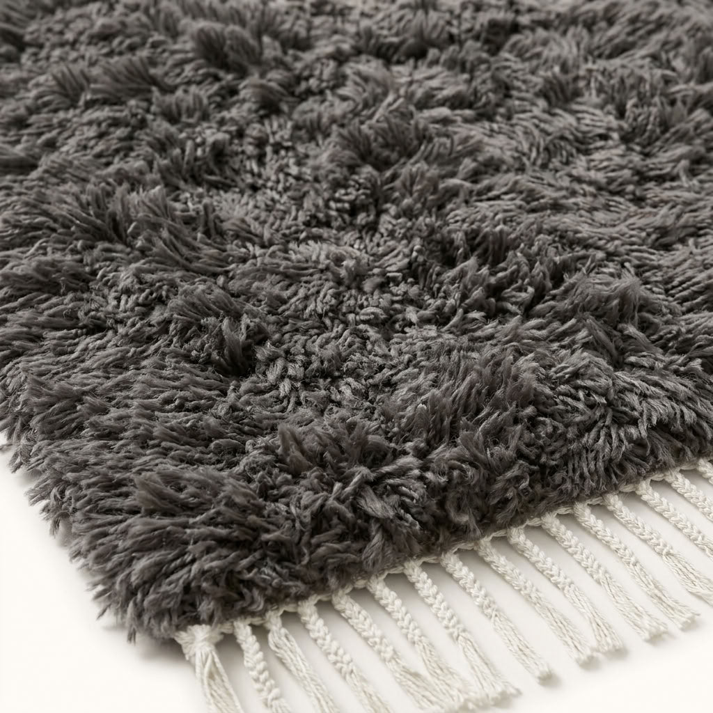 Angled close-up of charcoal Beni Ourain pile showing texture and depth of wool
