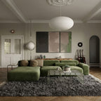 Charcoal Beni Ourain rug in modern living room under green sectional sofa