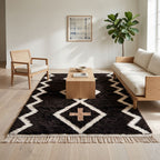 Charcoal Beni Ourain rug in modern living room with wooden furniture and neutral sofa
