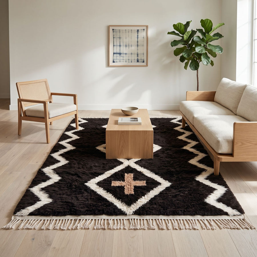 Charcoal Beni Ourain rug in modern living room with wooden furniture and neutral sofa