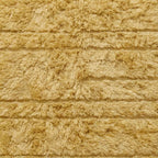 Cream Yakout rug corner detail showing fringe edge and textured horizontal rows