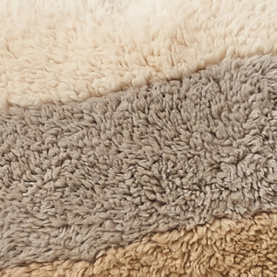 Close-up of the tonal bands pattern on the Tilelli Moroccan wool pillow