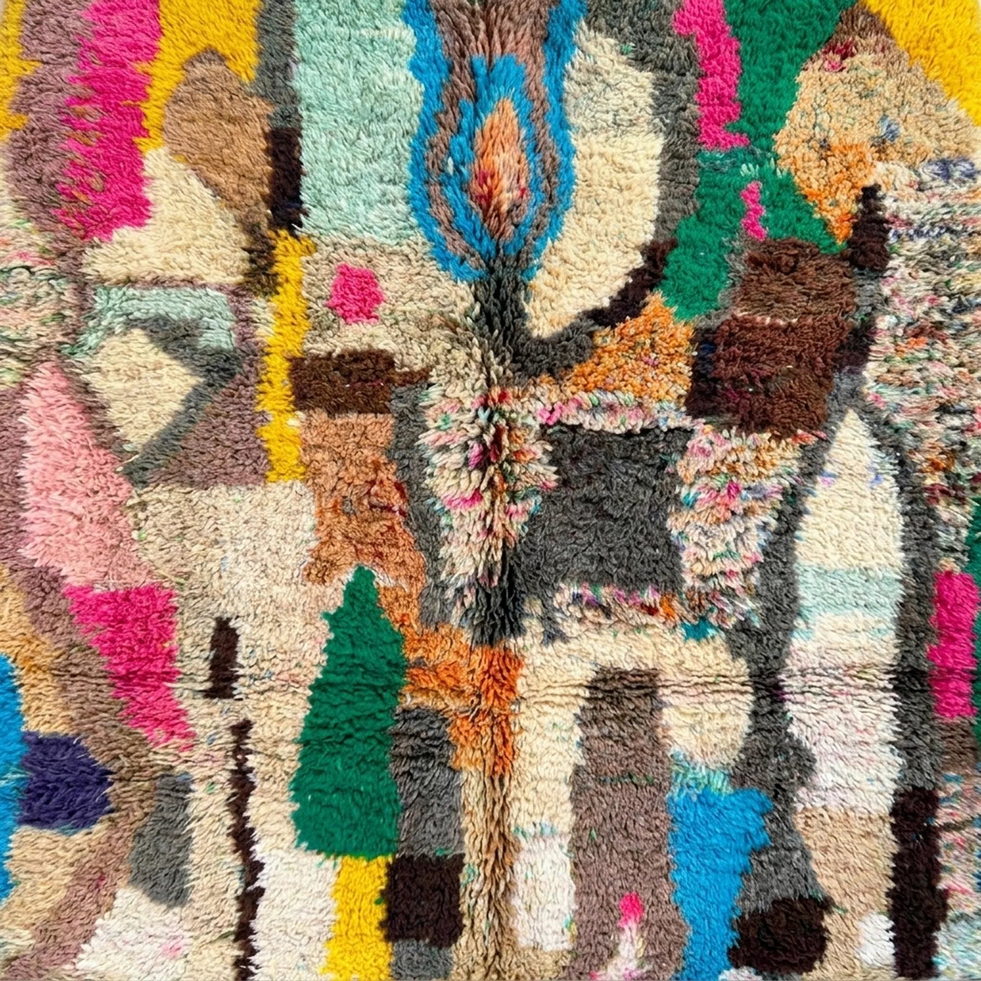 Detailed view of Tifran showing elongated green, blue and black symbols among pink, ochre and cream blocks