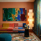 Asifran Boujaad rug styled in a room with its cream, terracotta and forest green diamond lattice visible