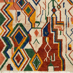 Diamond detail on the Asifran Boujaad rug with forest green, mustard, navy and terracotta accents