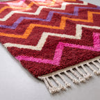 Angled detail shot of dense woven pile and chevron pattern construction