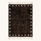 Full view of the dark brown and ivory square border Beni Ourain rug.