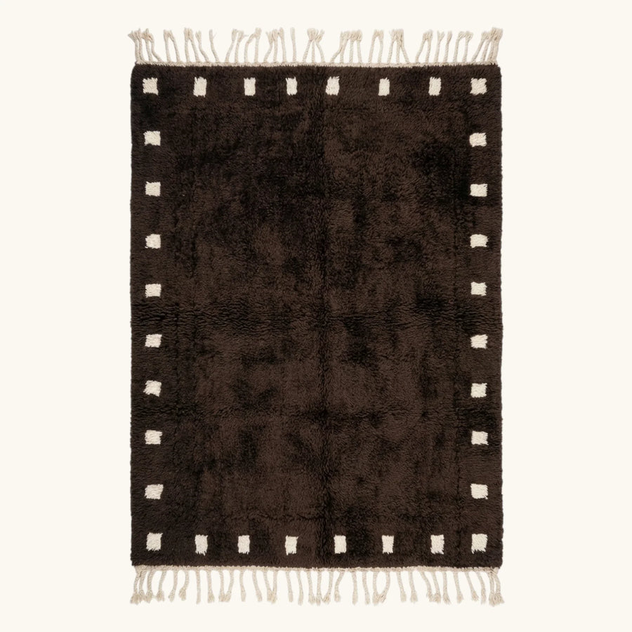 Full view of the dark brown and ivory square border Beni Ourain rug.