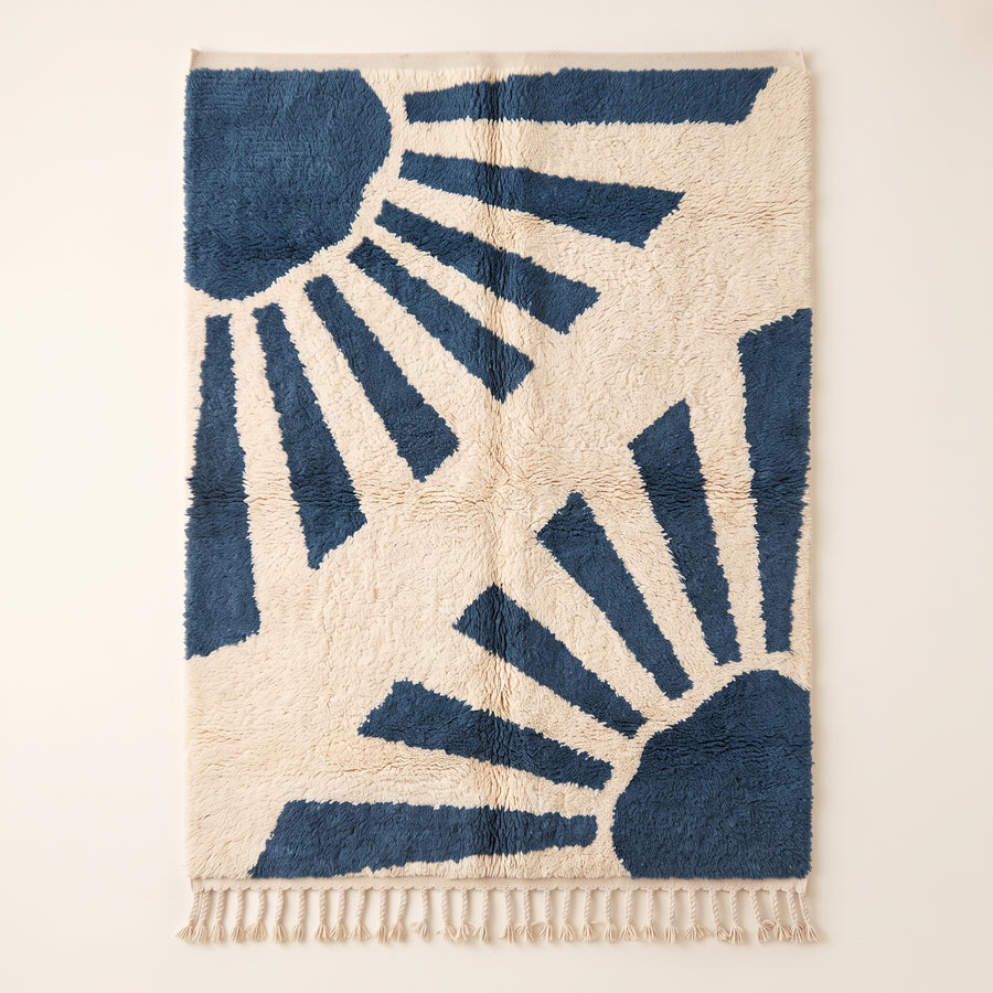 Denim & Ivory Beni Ourain Rug with Radiant Rays motif—full flat view showing sun-like radiating bands and corner geometric shapes