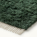 Close-up of ivory fringe and forest green pile edge on Beni Ourain rug Tafrara