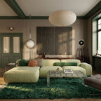Forest green Beni Ourain rug Tafrara in modern living room with pale sofa and green accents