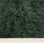 Overhead detail of textured pile on forest green Beni Ourain rug Tafrara