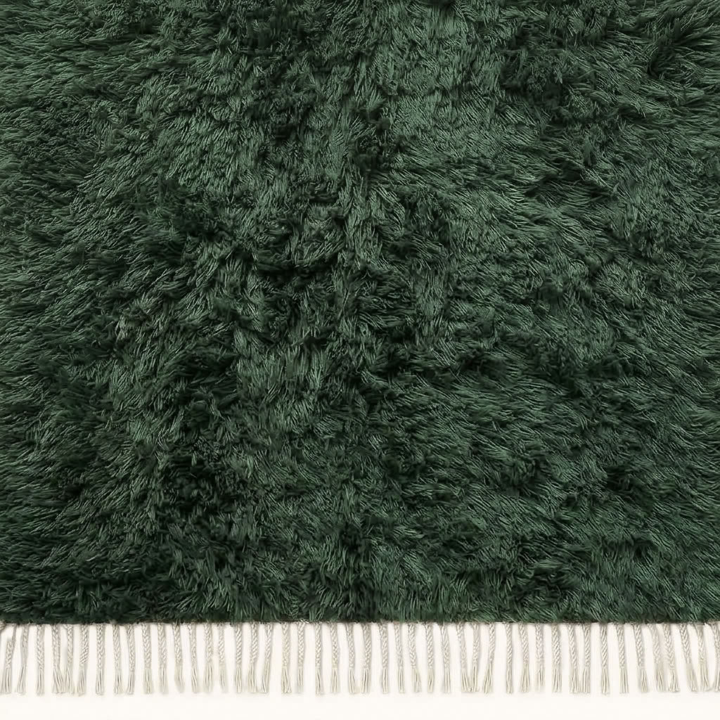 Overhead detail of textured pile on forest green Beni Ourain rug Tafrara