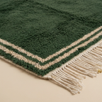 Natural Atlas wool pile and corner texture of the Tafukt Beni Ourain rug.