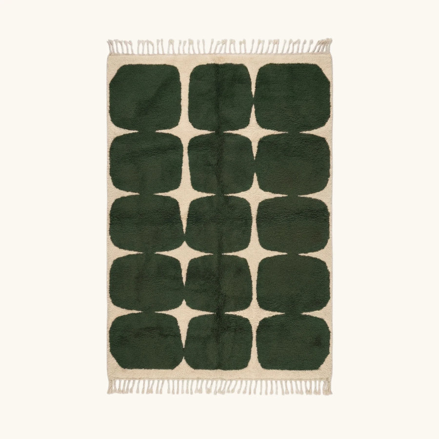 Full view of the Anir forest green and ivory Beni Ourain rug with a rounded grid design.