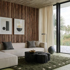Forest green and ivory square border Moroccan rug styled in a living room.