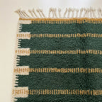 Full view of the Azru forest green, ochre and ivory Beni Ourain rug with a horizontal band design.