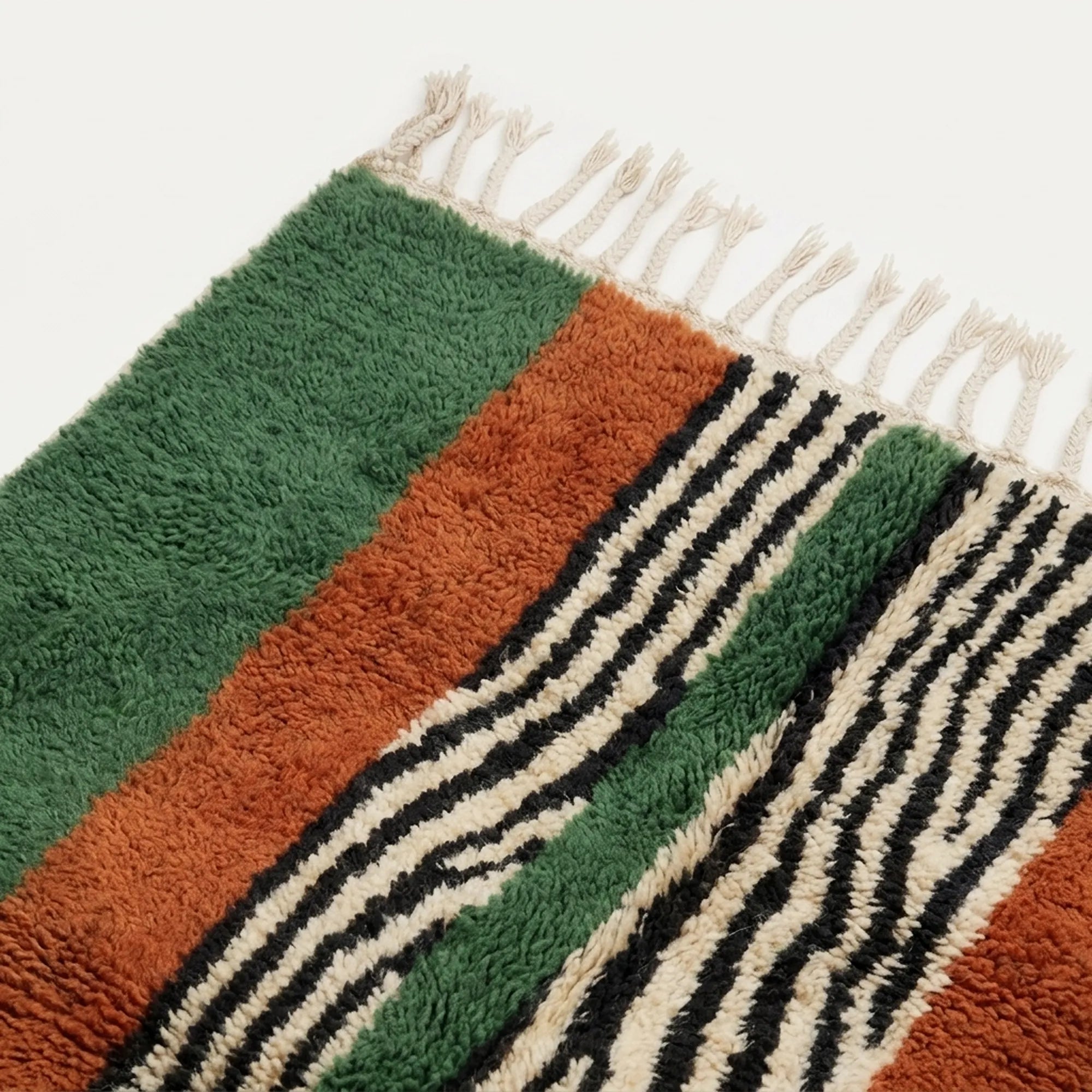 Close-up of the central stripe pattern on the Tanit rug.