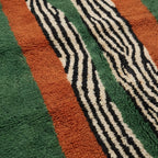 Angled view of the Tanit hand-knotted Beni Ourain rug.