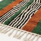 Border detail of the Tanit central stripe rug.