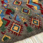Fringe and lower-edge detail of the Abridan Boujaad rug with colorful geometric symbols