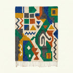 Full view of the Awragh Boujaad rug in green, mustard, cobalt, terracotta and cream with symbolic geometric patchwork
