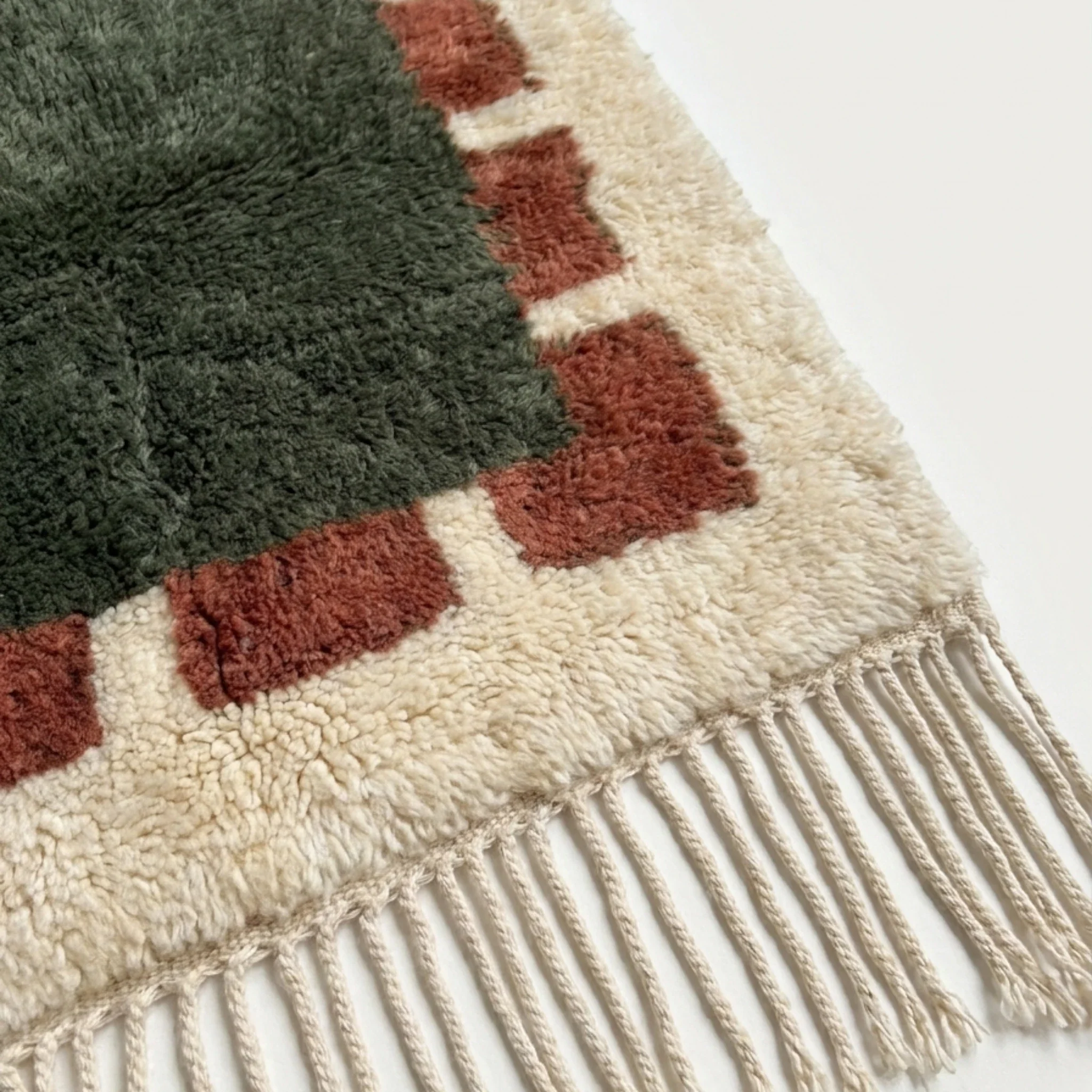 Green and rust Beni Ourain rug detail