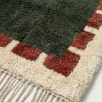 Green and rust Beni Ourain rug detail