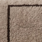 Close-up of the offset frame pattern on the Ilis Moroccan wool pillow