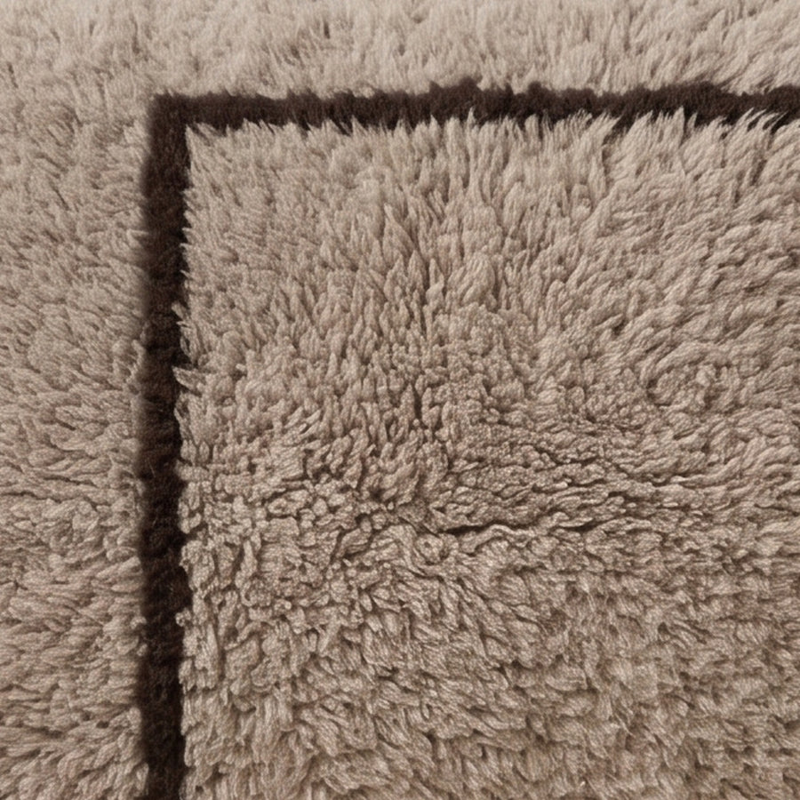 Close-up of the offset frame pattern on the Ilis Moroccan wool pillow