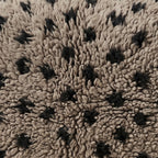 Close-up of the speckle grey pattern on the Ilili Moroccan wool pillow