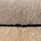 Close-up of the two tones pattern on the Tassa Moroccan wool pillow