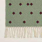 Sage and burgundy Zanafi rug Igli with scattered diamond design, border and fringe detail