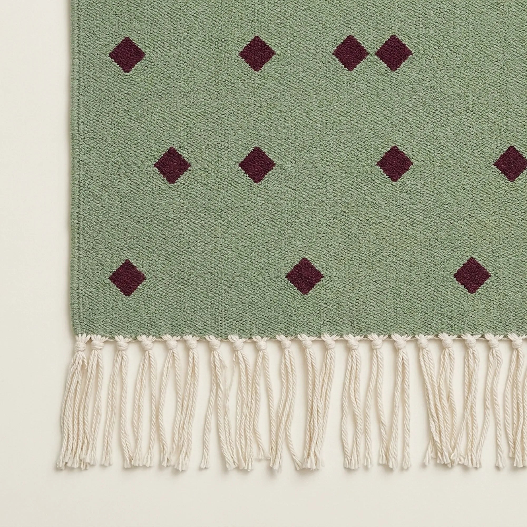 Sage and burgundy Zanafi rug Igli with scattered diamond design, border and fringe detail