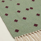 Sage and burgundy Zanafi rug Igli with scattered diamond design, pattern close-up