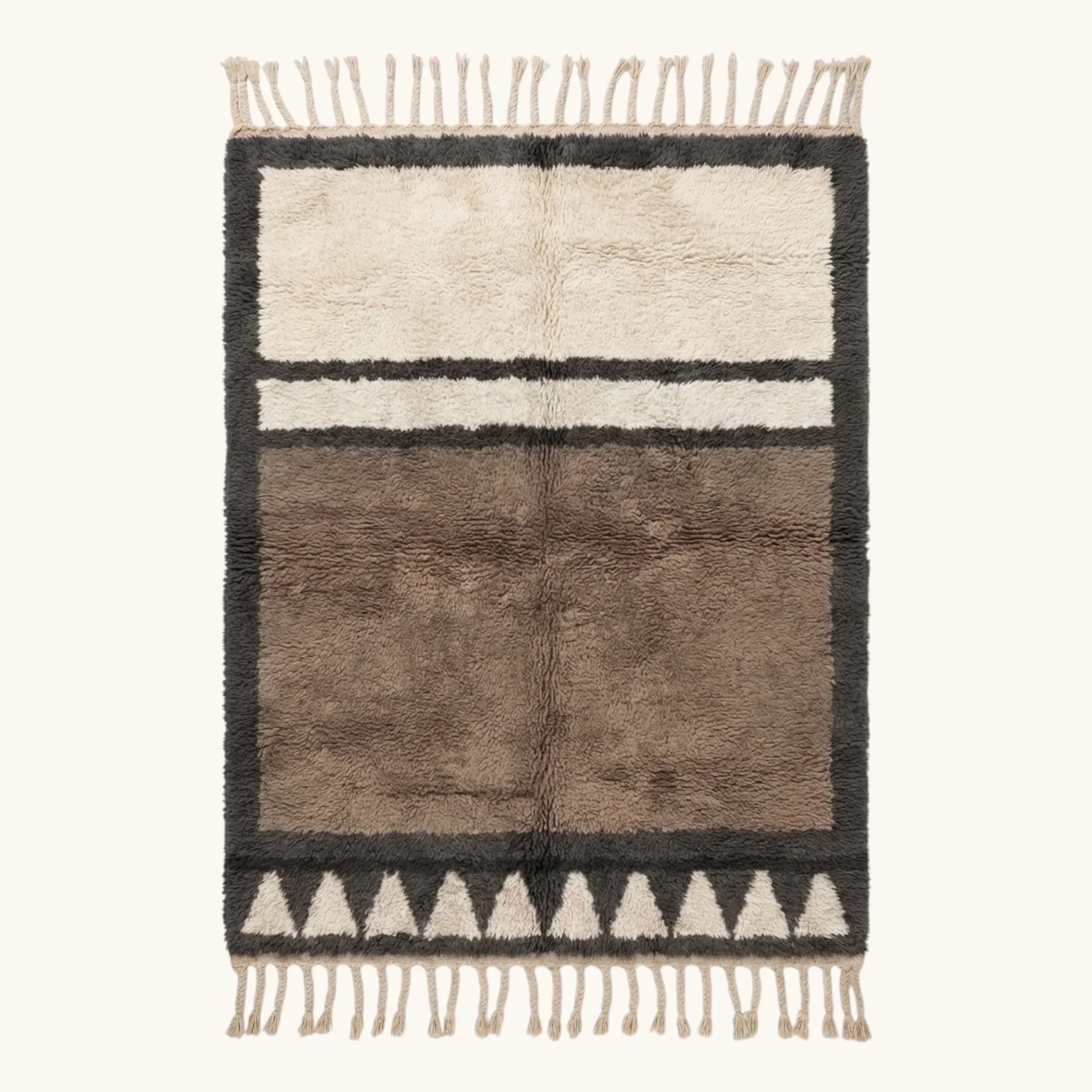 Full view of the Imilchil taupe Beni Ourain rug with a framed triangle motif and hand-tied fringe.