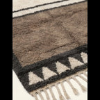 Close-up of the taupe and ivory framed triangle motif on the Imilchil rug.