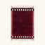 Itran burgundy Beni Ourain rug with checkered border motif, full view